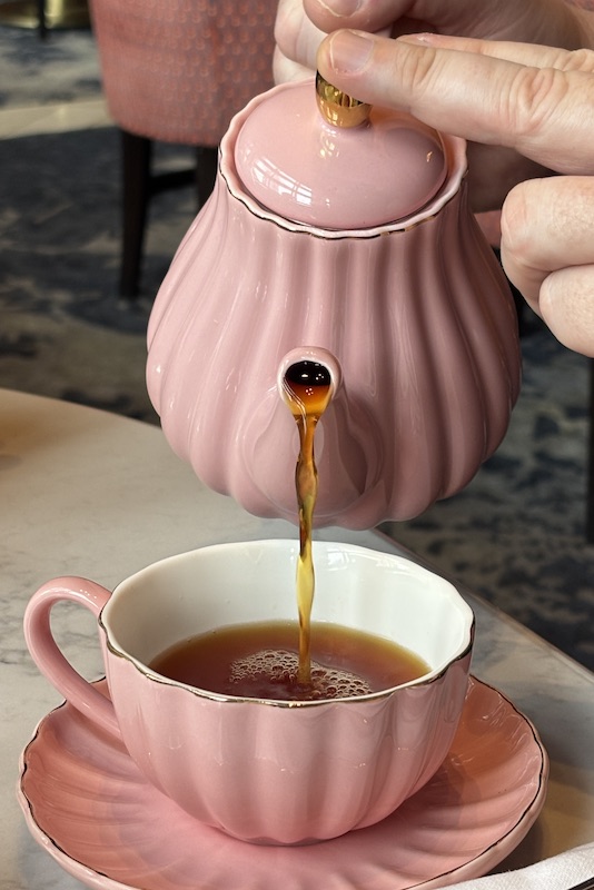 pouring tea at the new afternoon tea at Four Seasons Hotel Atlanta