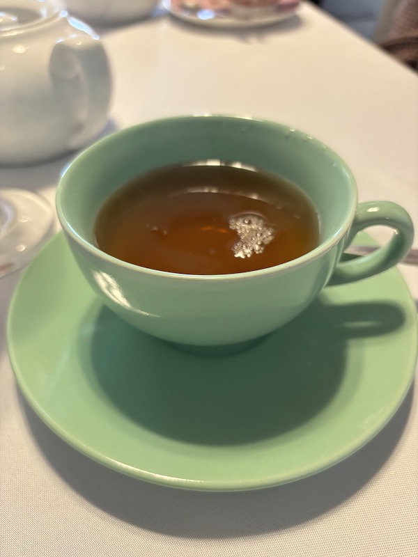 green teacup at afternoon tea at Anna's Tearoom in Springfield, Georgia.