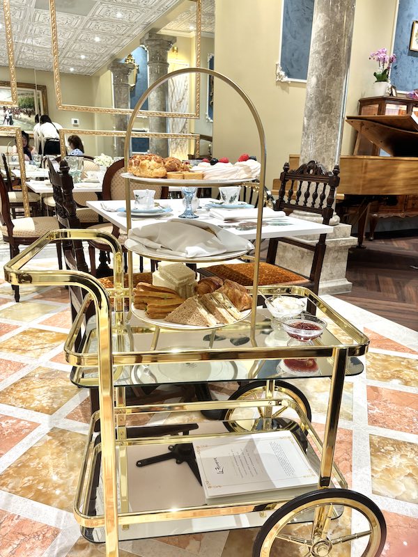 three-tiered tray on rolling tea cart at afternoon tea at Le Faucheur in Dunwoody, Atlanta, Georgia