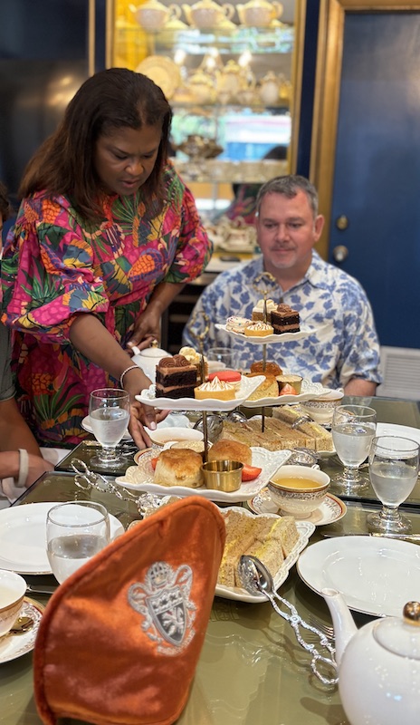 Loretta Thomas presents the three-tier trays at The Duchess Tea Salon at Cafe Channing Noelle in Nassau, Bahamas