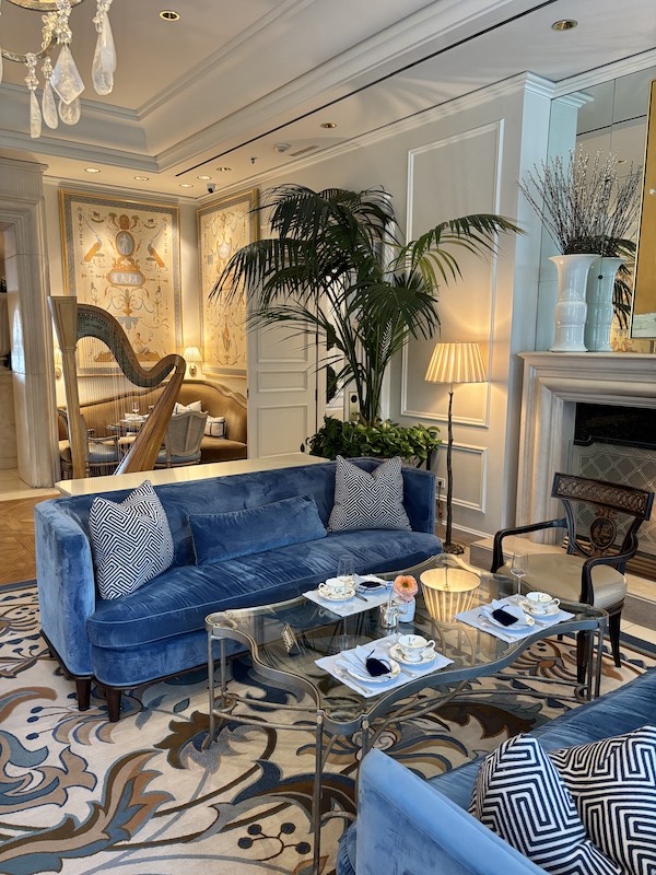 harpist and fireplace seating at afternoon tea at The Peninsula Beverly Hills, California